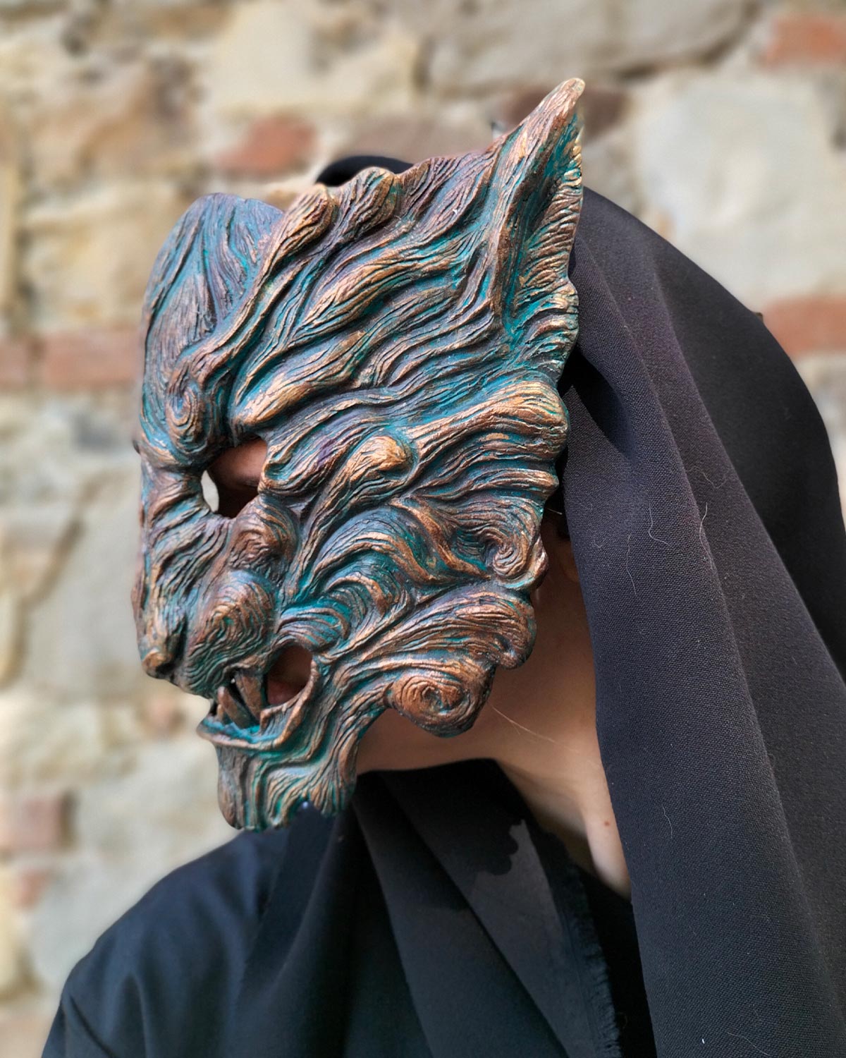 Left side view of handcrafted Oni mask with captivating oxidized colors, with details on color