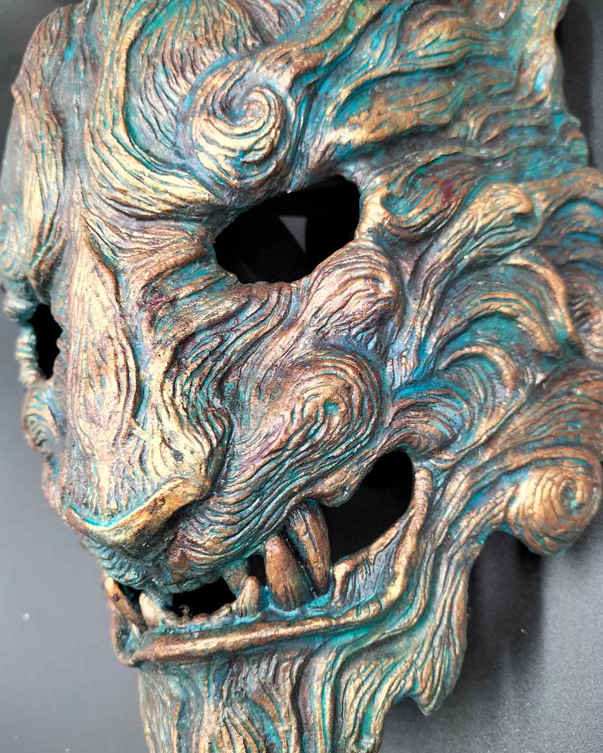 Details of handcrafted Oni mask with captivating oxidized colors